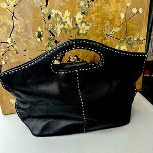 I loved this handbag but it's time for a new home.